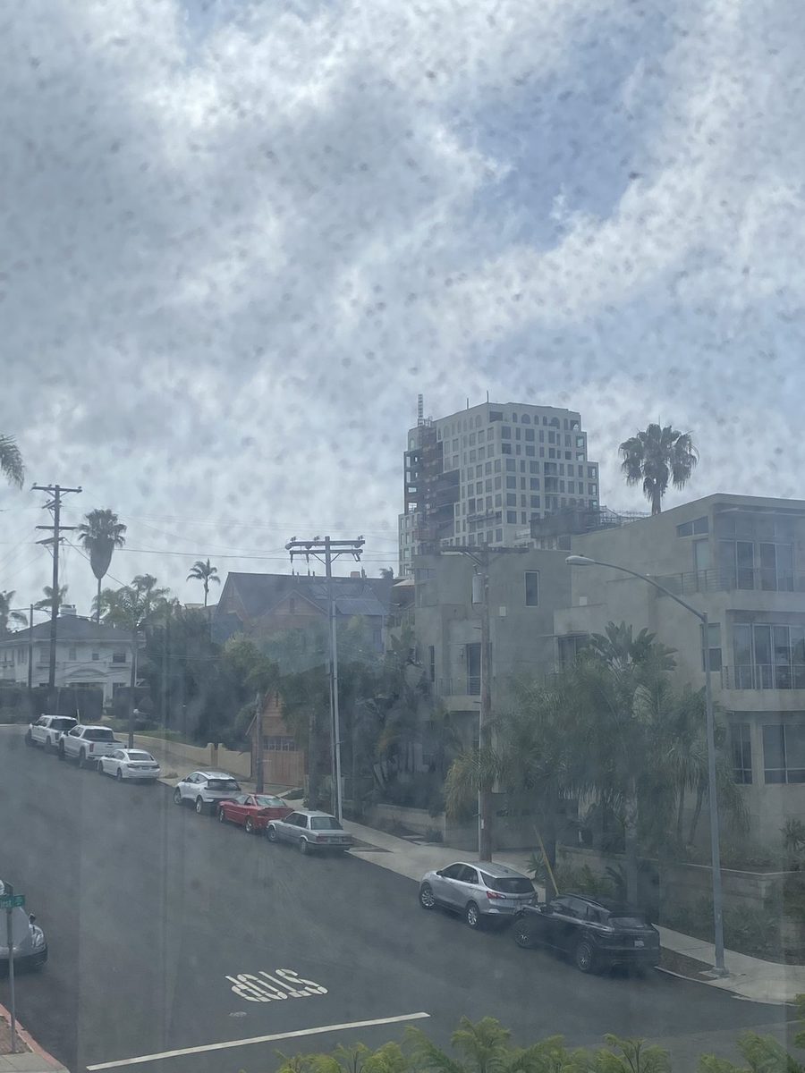 City view through a dirty window, before cleaning